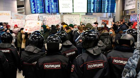 Riot police stand guard at Vnukovo airport in Moscow ahead of Alexei Navalny's arrival on Sunday.