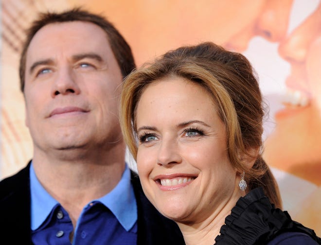 Kelly Preston and John Travolta attend her movie premiere "The last song" In Los Angeles on March 25, 2010.