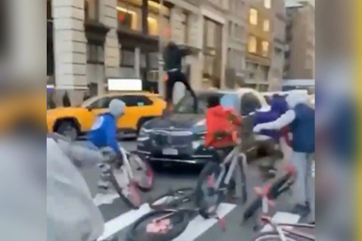 A 15-year-old has been arrested for the BMW bike gang attack in New York City