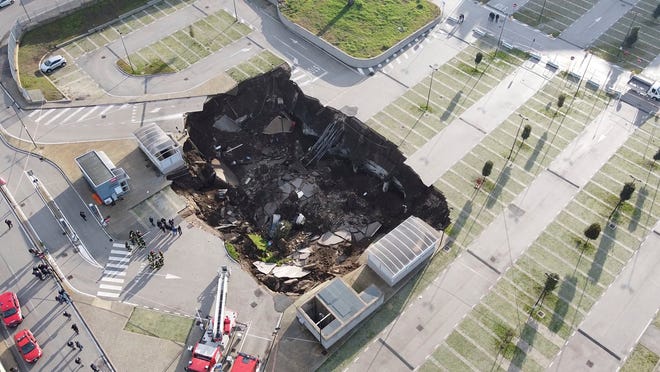 A hole in a hospital parking lot in Italy disrupts COVID-19 treatment