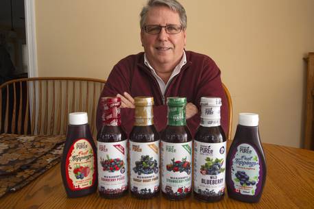 Tom Margeson, president and CEO of Healthy Berries Ltd., with some of his Superfruit Puree products at his Beaver Bank home on Monday, Feb. 1, 2021.