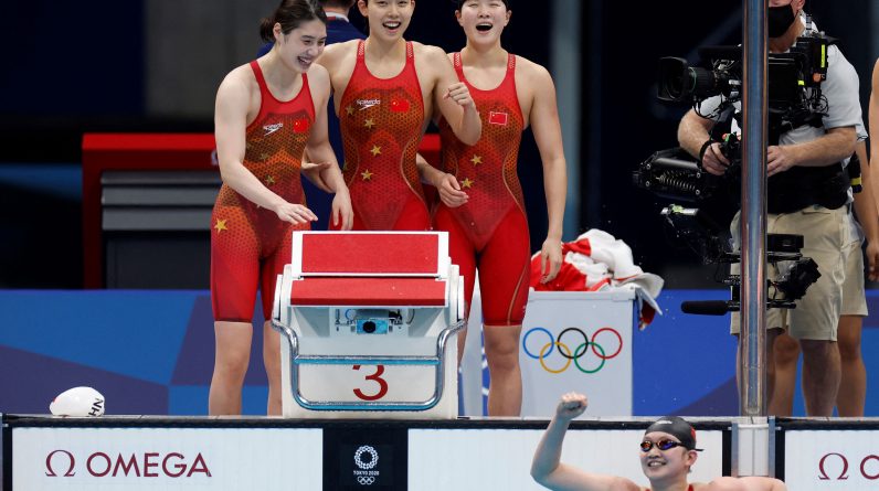 The Chinese team celebrates after taking gold in the 4x200-meter freestyle on July 29.