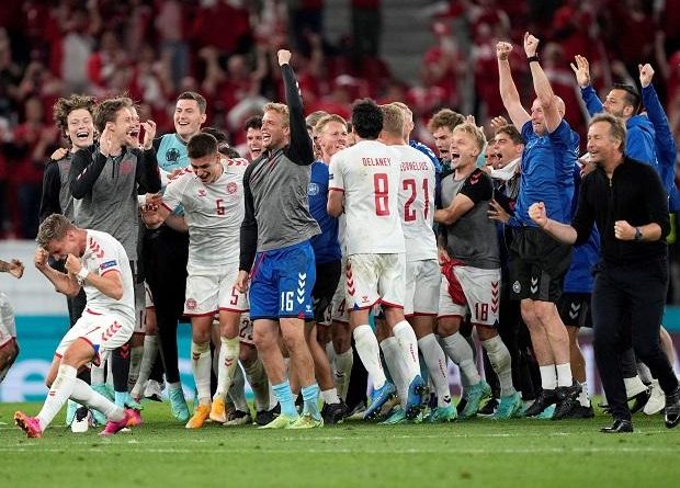 Denmark football team celebrates after winning its last group game and qualifies for Euro 2020 round of 16. Photo: @Euro2020