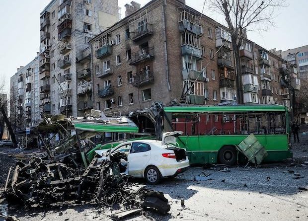 A view shows a building and vehicles destroyed by shelling as Russia