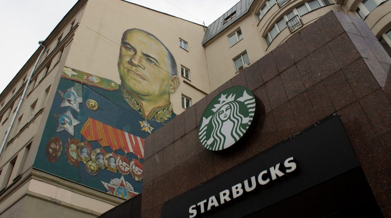 A Starbucks coffee shop alongside a mural of Georgy Zhukov, a Soviet general and Marshal of the Soviet Union, in Moscow, Russia, on March 27.