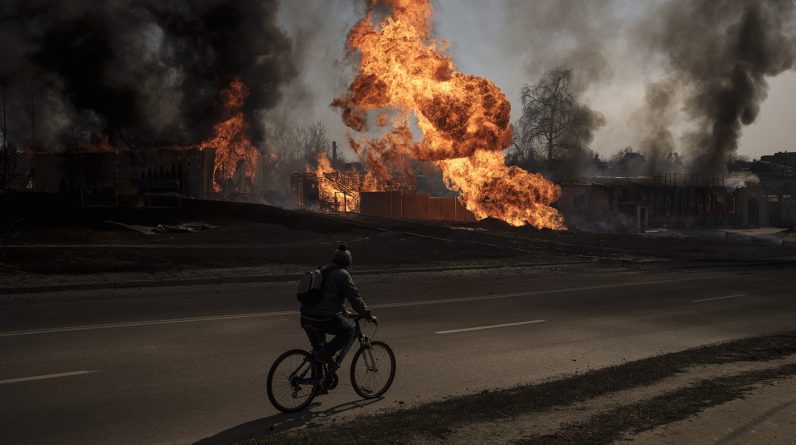A man near a fire following a Russian attack in Kharkiv, Ukraine (Image: AAP/AP/Felipe Dana)